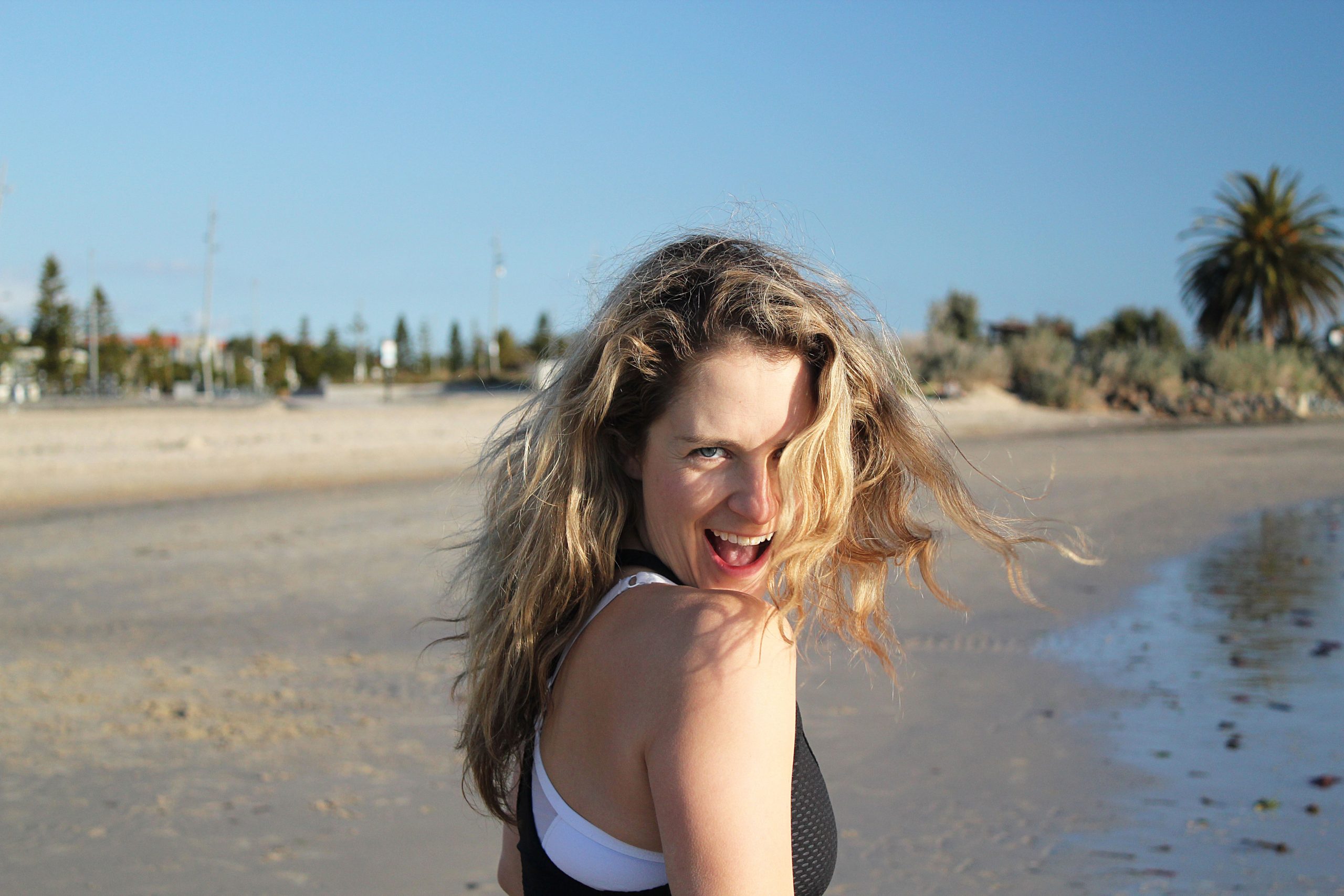 Close up of woman laughing at the beach