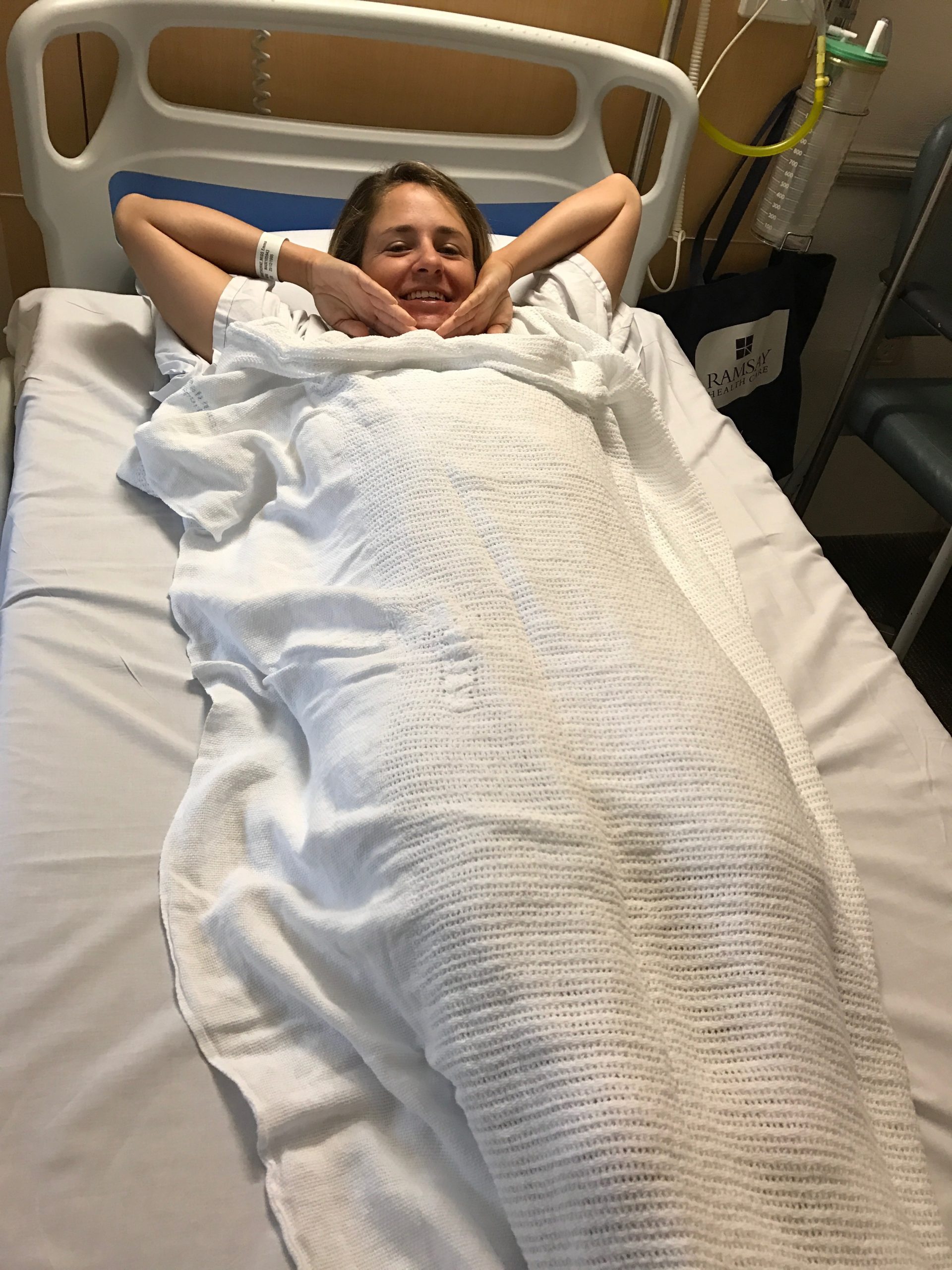 woman lying in hospital before surgery for a vocal injury