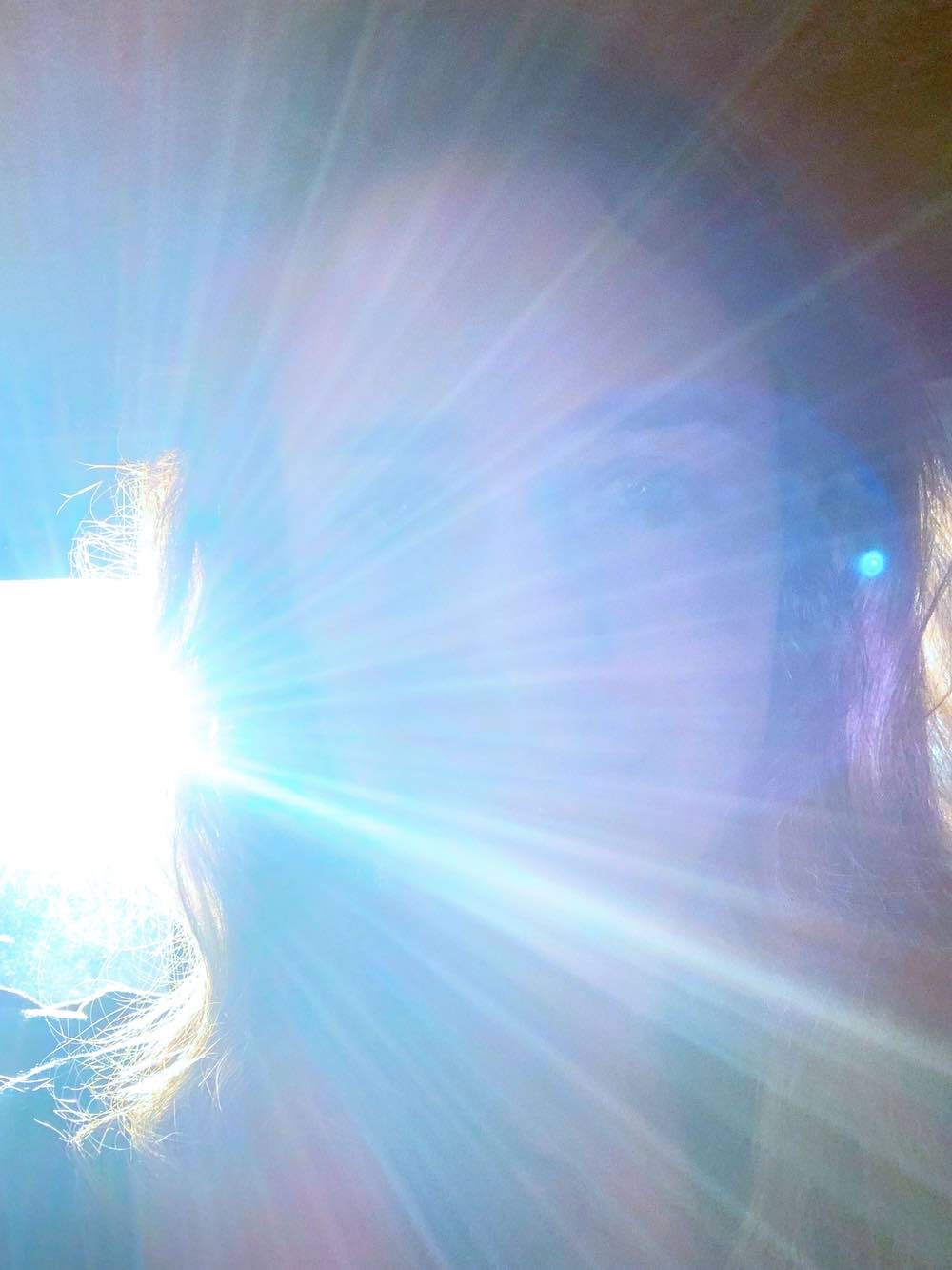 Woman's face in the sun light