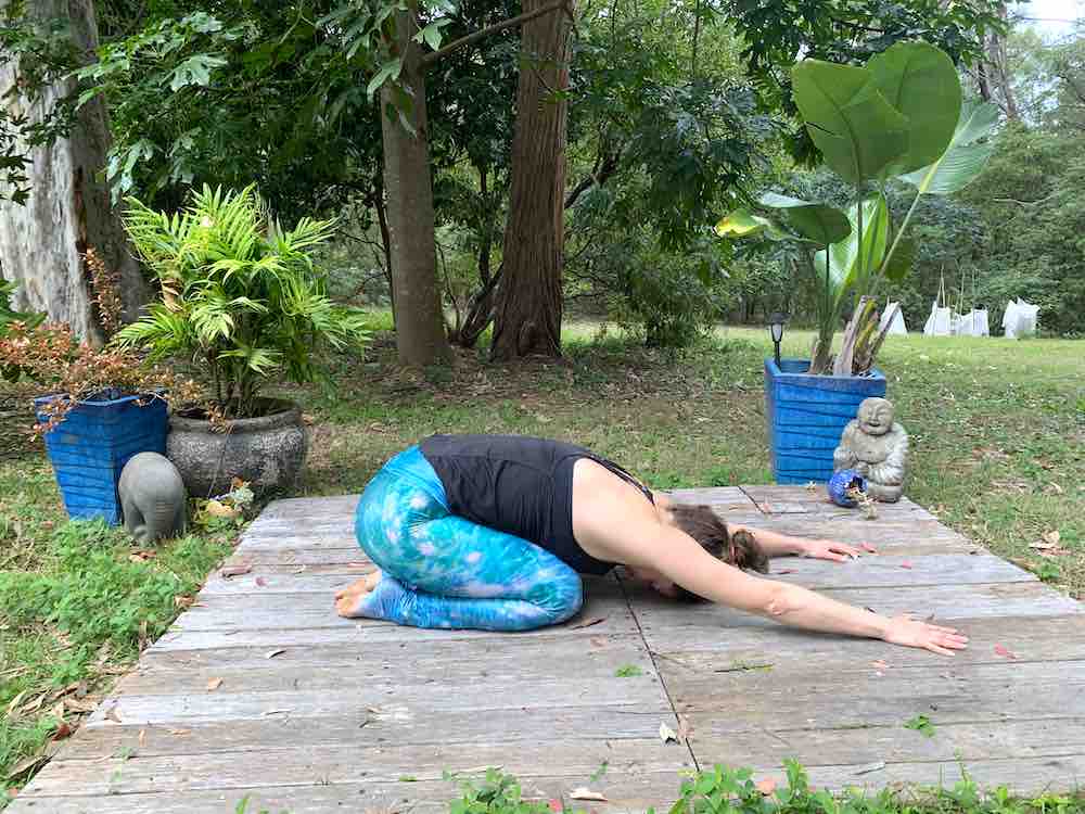 Woman doing Balasana Yoga Pose